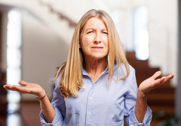 Woman holding her hands up in confusion